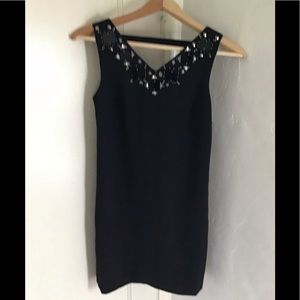 Black cocktail dress with jewels sewed on.